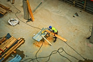 Construction Workers Using Power Tools